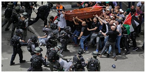 Israeli police confront with mourners as they carry the casket of slain Al Jazeera veteran journalist Shireen Abu Akleh during her funeral in east Jerusalem, Friday, May 13, 2022. (Photo | AP)