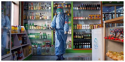 An employee of the Kyonghung Foodstuff General Store disinfects the showroom in Pyongyang, North Korea, Wednesday, Nov. 10, 2021. (Photo | AP)