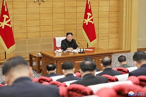 North Korean leader Kim Jong Un, top, attends a meeting on anti-virus strategies in Pyongyang. (Photo | AP)