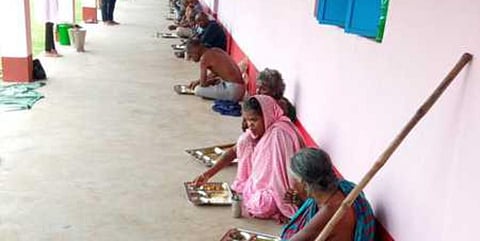Beggars enjoy a meal organised by the volunteers in Cuttack. (Photo| EPS)