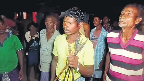 Villagers with bows and arrows during the attack on cops. (Photo| EPS)