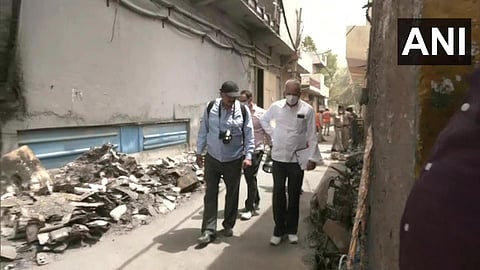NHRC team visits the commercial building in Mundka which was gutted in a massive fire on May 13. (Photo | ANI Twitter)