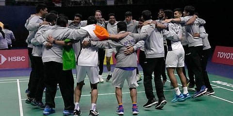 India's Srikanth Kidambi, with the national flag, and his teammate celebrate after winning a point against Indonesia's Jonatan Christie. (Photo | AP)