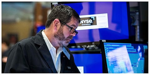 Trader James MacGilvray works on the floor, Friday, May 13, 2022. (Photo |AP)