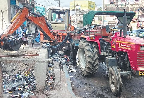 Drains being cleaned in Cuttack by CMC workers . (File Photo)