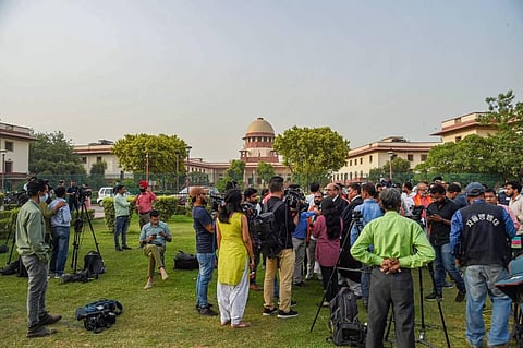 Media personnel gather and interact with Advocate Barun Kumar Sinha, who is representing Hindu Sena after the hearing of the case of Varanasi's Gyanvapi Masjid-Shringar Gauri Temple complex's survey.