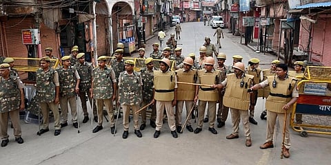 Varanasi: Policemen stand guard during the third and last day of a videographic survey at Gyanvapi Mosque complex. (Photo | PTI)