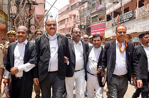 Court Commissioners Vishal Singh (2L) and Ajay Pratap Singh (L) with their team leave after the survey at Gyanvapi Mosque complex, May 16, 2022. (Photo | PTI)