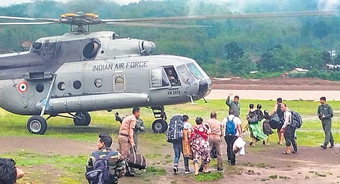 An IAF helicopter airlifts rail passengers who were stranded in Dima Hasao | pti