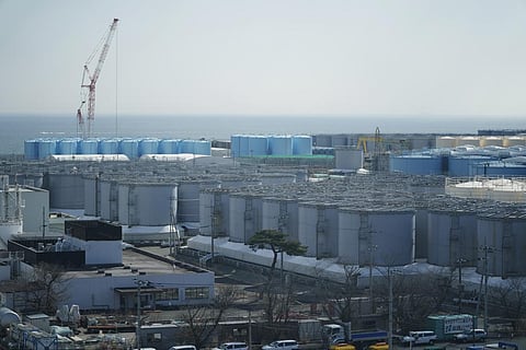 Tanks storing treated radioactive water after it was used to cool the melted fuel are seen at the Fukushima Daiichi nuclear power plant. (Photo | AP)