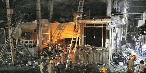 Fire Brigade personnel carry out rescue work after a massive fire which broke out at an office building near the Mundka Metro Station, in West Delhi. (File photo| ANI)