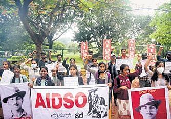 AIDSO members stage a protest in Mysuru on Tuesday against the state government