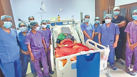 Surgeons with the patient post surgery at SUM Hospital | Express