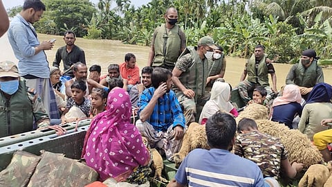 Army personnel rescuing the flood-affected in Assam. (Photo | Special Arrangement)