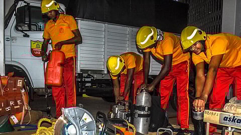Odisha Fire Services personnel handling gas cylinders and other equipment. Image used for representational purposes only.