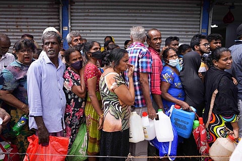People queue up to buy kerosene oil for cooking amid cooking gas shortages in Colombo, Sri Lanka, Tuesday, May 17, 2022. (Photo | AP)