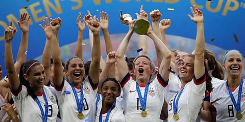US' Megan Rapinoe lifts up the trophy after winning the Women's World Cup final soccer match between US and The Netherlands at the Stade de Lyon in Decines, France. (Photo | AP)