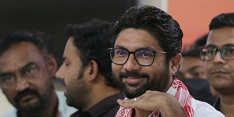 Gujarat MLA Jignesh Mevani enacts a gesture from Telugu movie 'Pushpa - The Rise'. (Photo | Shekhar Yadav, EPS)