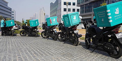 A delivery driver for the app Deliveroo prepares to make a delivery, in Dubai, United Arab Emirates, Sept. 9, 2021. (Photo | AP)