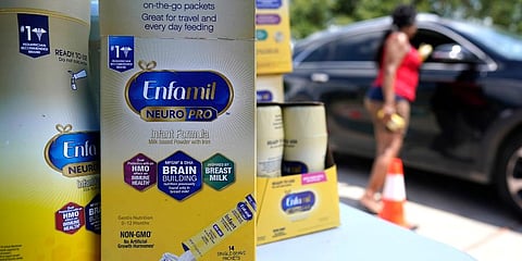 Katherine Gibson-Haynes helps distribute infant formula during a baby formula drive in Houston. (Photo | AP)