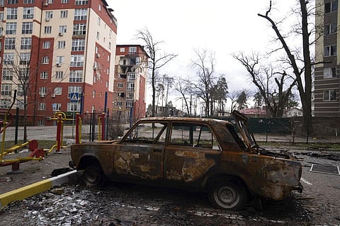A damaged by shelling car is seen in a yard in Irpin, in the outskirts of Kyiv, Ukraine. (File Photo | AP)