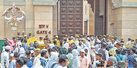 Security personnel stand guard as Muslims arrive in a large number at the Gyanvapi mosque in Varanasi on Friday | PTI