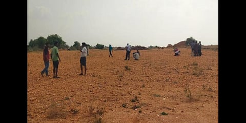 Enthusiasts were trying to test their luck by searching to color stones in Jonnagiri farm lands. (Express)