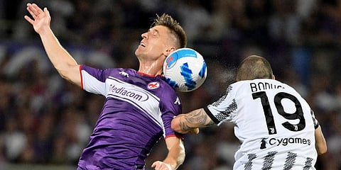 Fiorentina's Krzysztof Piatek (L) vies for the ball with Juventus Leonardo Bonucci during a Serie A soccer match between Fiorentina and Juventus, in Florence's Artemio Franchi stadium. (Photo | AP)