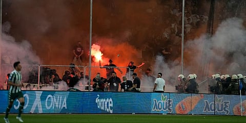 PAOK fans clash with police during the Greek Cup Final soccer match between Panathinaikos and PAOK at the Olympic stadium in Athens, Greece. (Photo | AP)