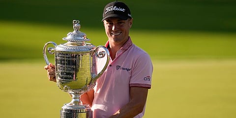 Justin Thomas holds the Wanamaker Trophy after winning the PGA Championship golf tournament in a playoff against Will Zalatoris at Southern Hills Country Club in Tulsa, Okla. (Photo | AP)