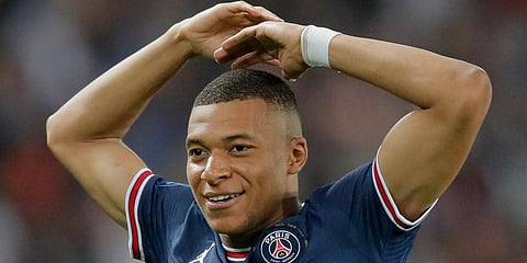 PSG's Kylian Mbappe celebrates after scoring his third goal during the French League One soccer match against Metz at the Parc des Princes stadium in Paris, France. (Photo | AP)