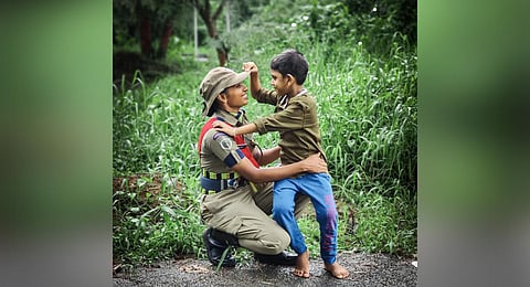 Noujisha with son Aiham Nazal after her passing-out parade in Thrissur on Sunday. (Photo | Express)