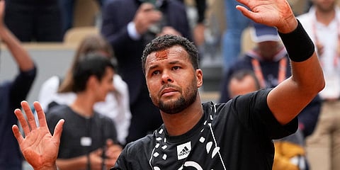 France's Jo-Wilfried Tsonga waves after losing to Norway's Casper Ruud in a French Open match at the Roland Garros stadium in Paris. (Photo| AP)