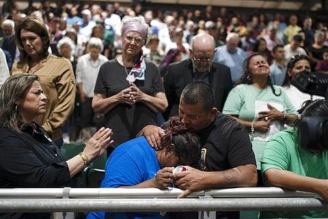 Two family members of one of the victims killed in Tuesday's shooting at Robb Elementary School comfort each other during a prayer vigil in Uvalde, Texas. (Photo | AP)