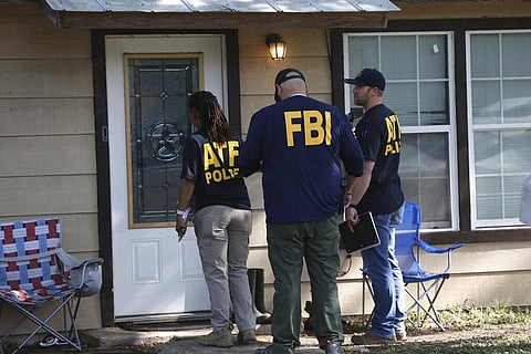 FBI and ATF agents canvass the area around Robb Elementary School in Uvalde, Texas, Wednesday, May 25, 2022. (Photo | AP)