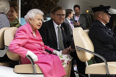 Britain's Queen Elizabeth II sitting in a buggy visits the RHS (Royal Horticultural Society) Chelsea Flower Show, at the Royal Hospital Chelsea. (Photo | AP)