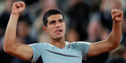 Carlos Alcaraz celebrates winning against Sebastian Korda in three sets, 6-4, 6-4, 6-2, during their third round match at the French Open tennis tournament in Roland Garros Stadium. (Photo | AP)