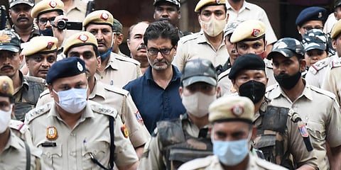 Kashmiri separatist leader Yasin Malik is escorted by police officers to a court in New Delhi. (Photo| Parveen Negi, EPS)