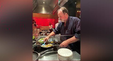 William Dalrymple cooking tiger prawns.