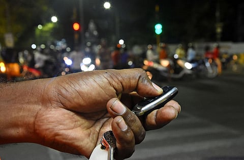 A traffic cop uses remote to control traffic signals. (Photo | Ashwin Prasath, EPS)