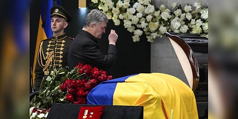 Former President of Ukraine Petro Poroshenko makes the cross over the coffin of Leonid Kravchuk, independent Ukraine's first president(Photo | AP)