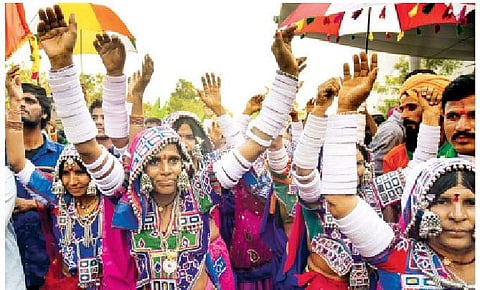 Members of Lambada community staging protest. (Photo | Vinay Madapu, EPS)