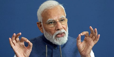 PM Narendra Modi addresses the media during a joint press stratement as part of a meeting with German Chancellor Olaf Scholz at the chancellery in Berlin, Germany. (Photo | AP)