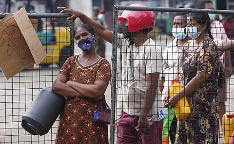 Residents wait in long lines to buy kerosene oil in Colombo, Sri Lanka, Friday, March 25, 2022. (Photo | AP)