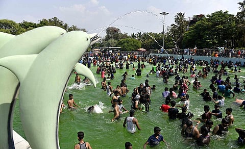 To beat the scorching summer heat, people enjoy splashes of water at Jalvihar on Sunday afternoon. (Photo | Vinay Madapu, EPS)