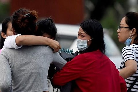 Family members and relatives of passengers on board the Twin Otter aircraft operated by Tara Air cry outside the airport in Pokhara on Sunday(Photo | AFP)