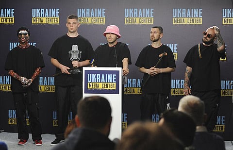 Oleh Psiuk, center, frontman of Ukraine's Kalush Orchestra winner of the Eurovision Song Contest, and other members of his band attend a news conference in Lviv. (Photo | AP)