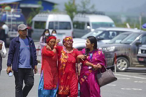 Relatives of passengers of the Tara Air turboprop Twin Otter plane that crashed wail outside the airport in Pokhara, Nepal, Monday, May 30, 2022. (Photo | AP)
