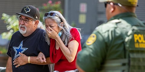 A woman cries as she leaves the Uvalde Civic Center, in Uvalde, Texas. (Photo | AP)