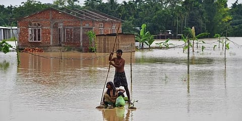 More than 1,76,900 persons are hit by the floods in Cachar, Dima Hasao, Morigaon and Nagaon districts. (Photo | AFP)